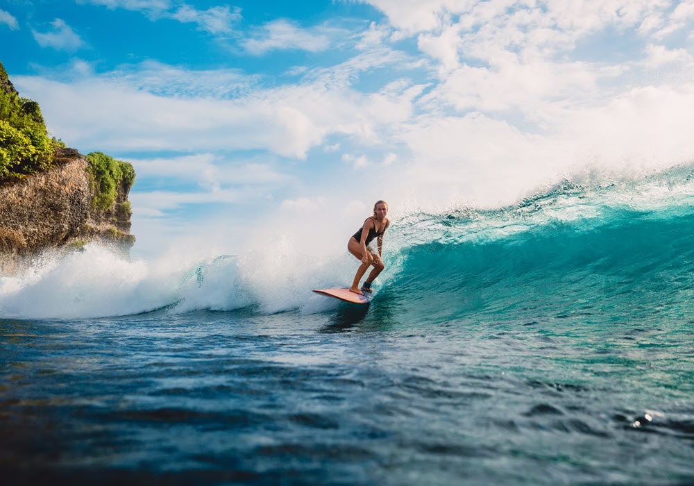 Woman surfing in the ocean 