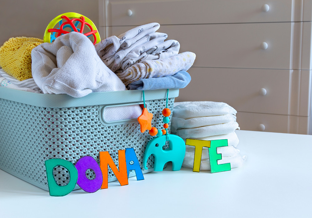 Baby basket with towels and a donate sign