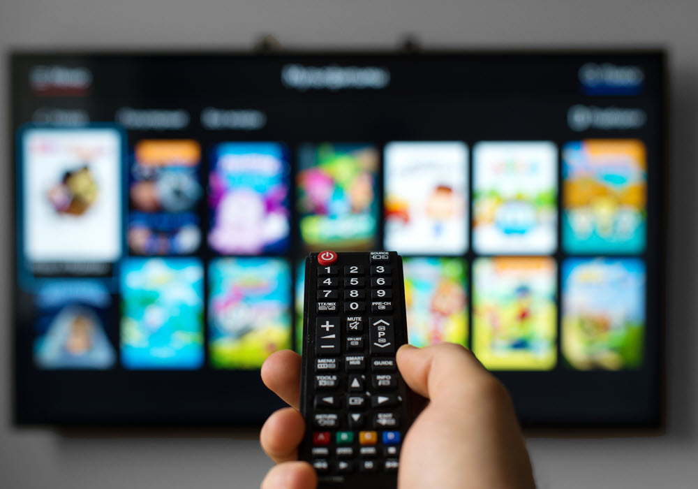 Resident choosing a movie from a TV streaming service.