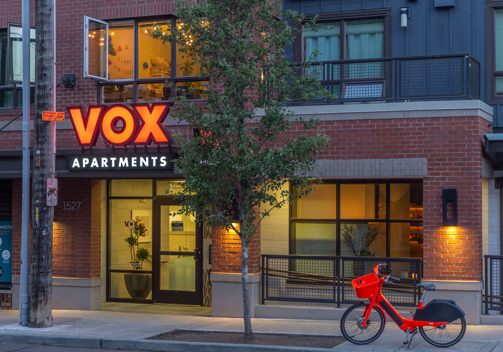 Front entrance view of Vox Apartments in Seattle.