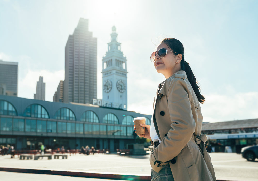 Woman with coffee in Downtown San Jose.