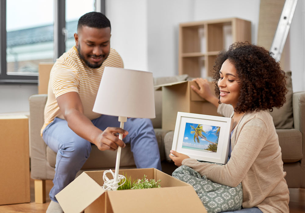 Couple unpacking their moving boxes.