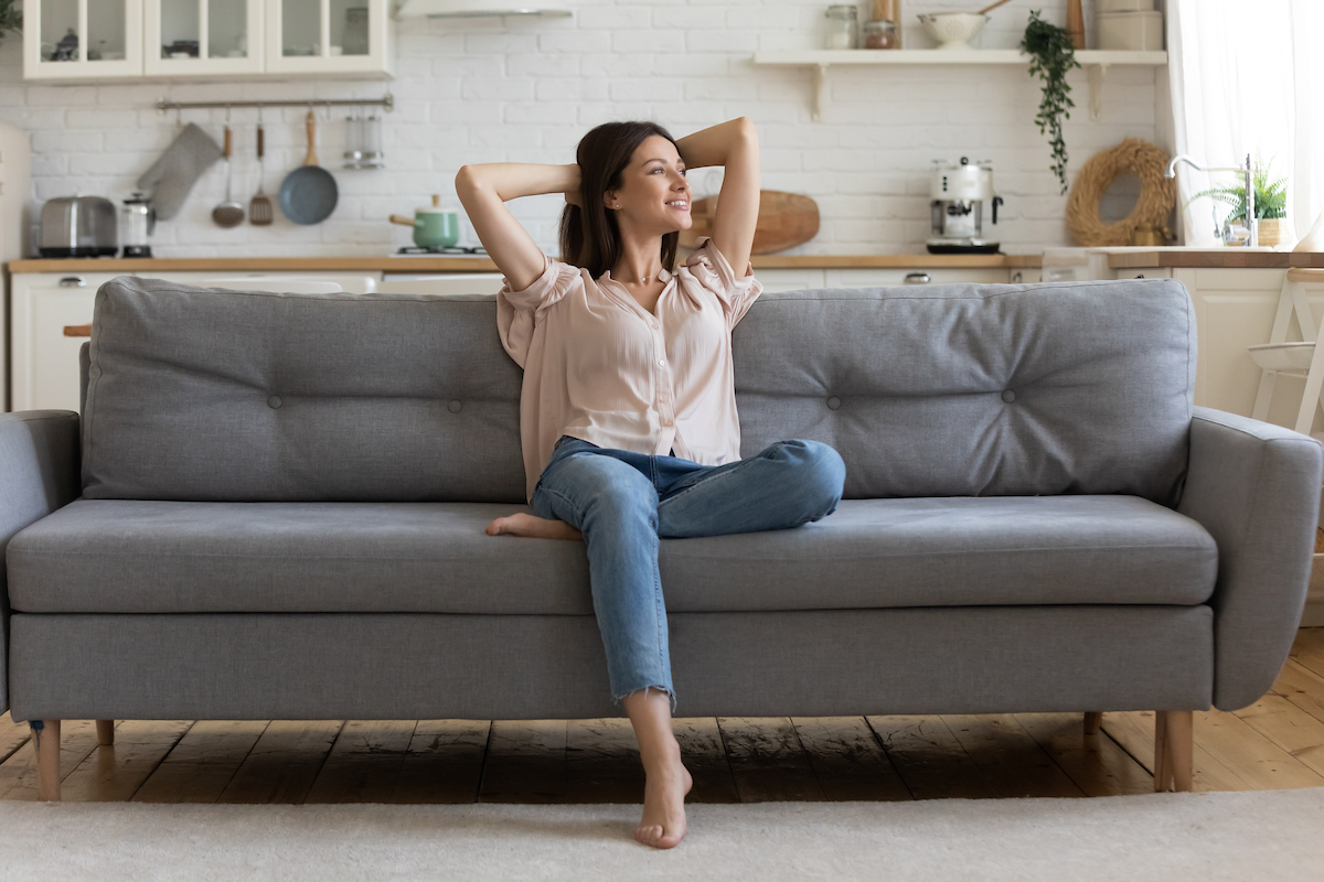Thriving Solo: 10 Ways to Beat Loneliness in Single Living - Sitting on the couch alone