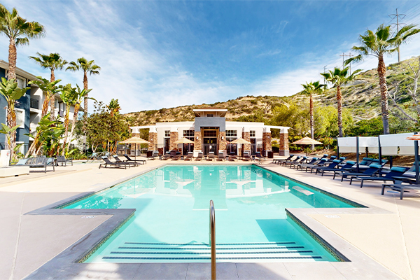 Swimming pool with lounge furniture