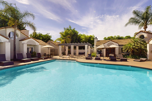 Swimming pool with lounge furniture