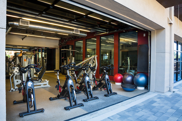 Fitness center with cardio and strength training equipment.