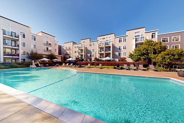 Swimming pool with outdoor lounge furniture.